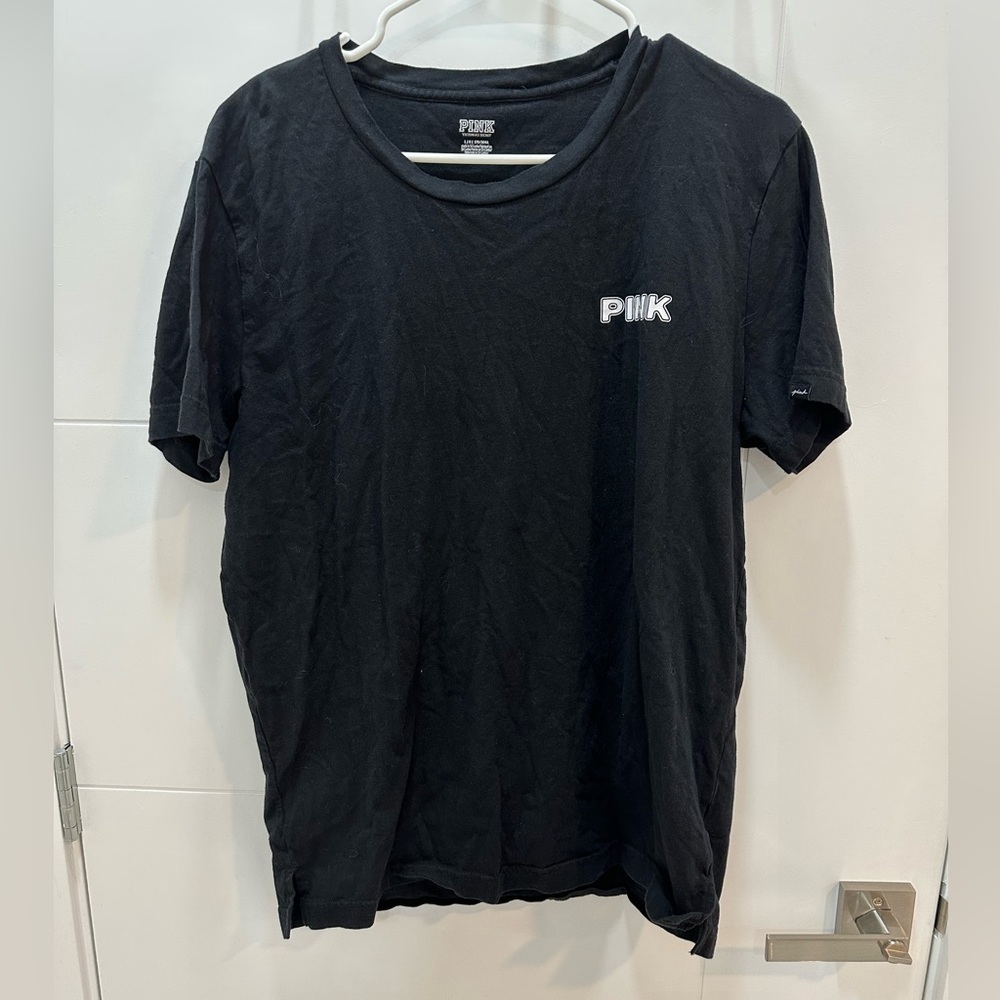 Pink large black tee with design in the back